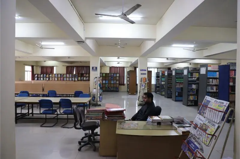 Library with reading tables and book stacks