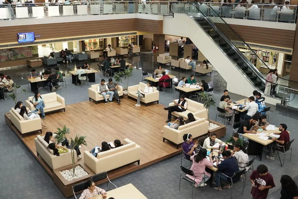 Library atrium with lounge seating and reading tables