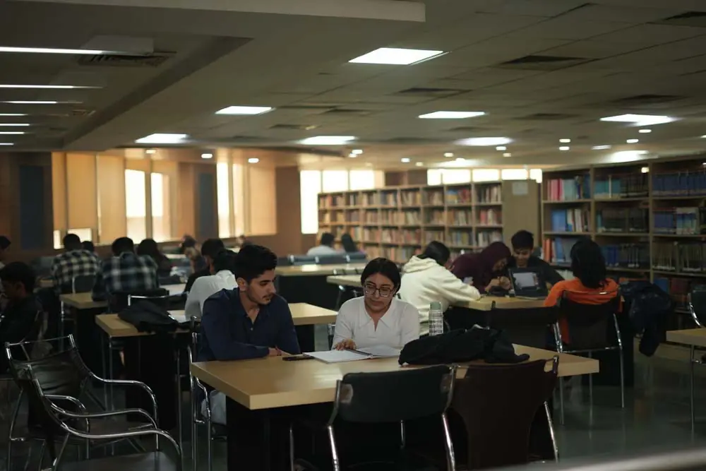 Library reading hall with bookshelves