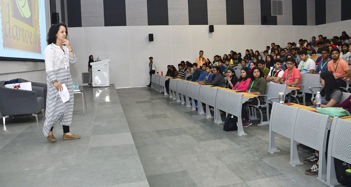 Large tiered classroom with students