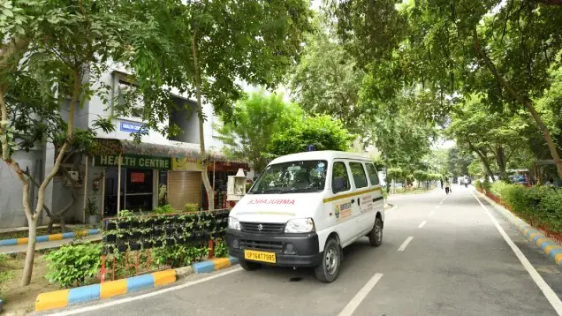 Tree-lined campus road near the health centre