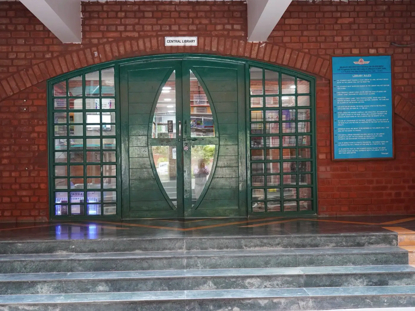 Central library entrance with arched glass doors