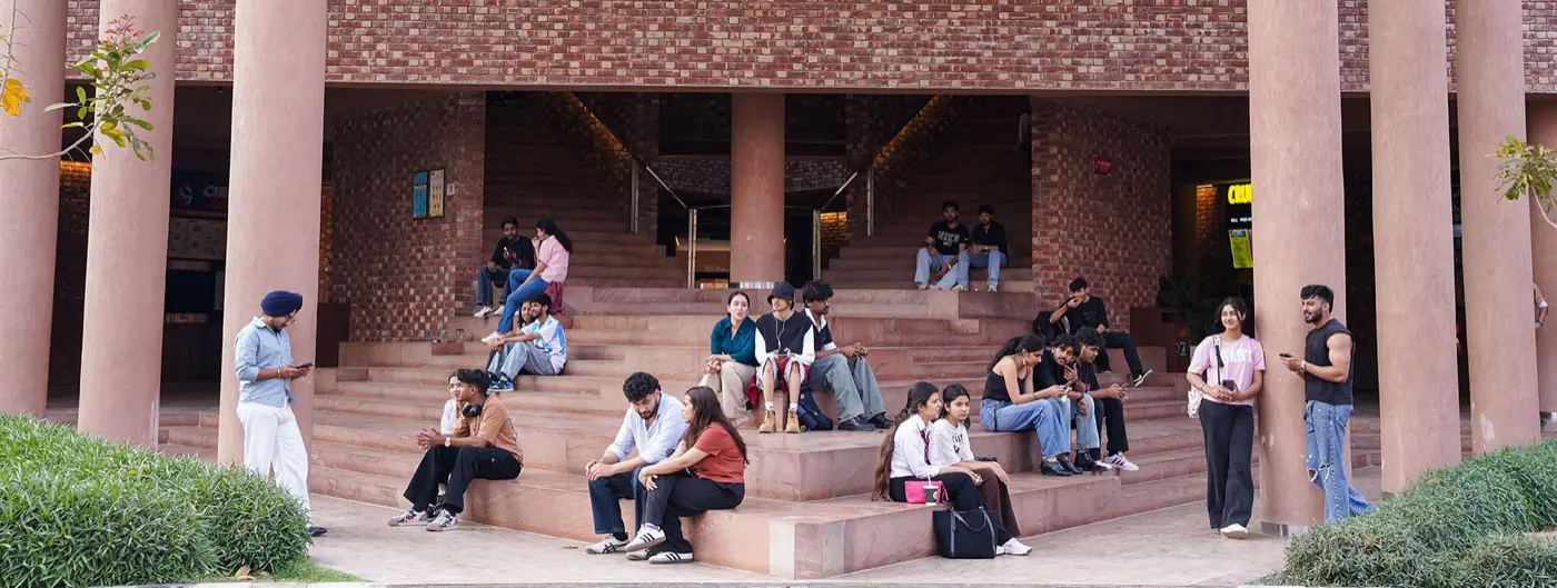 Open-air amphitheatre steps outside an academic block