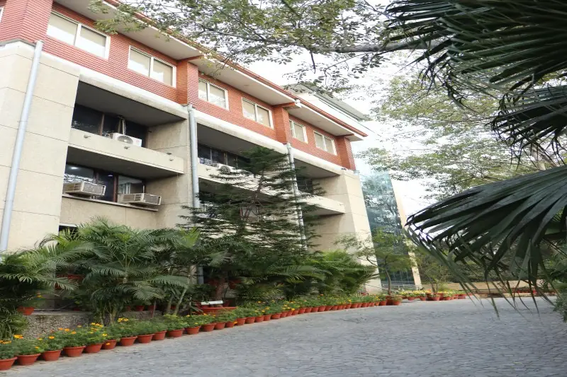 Academic block exterior with landscaped driveway