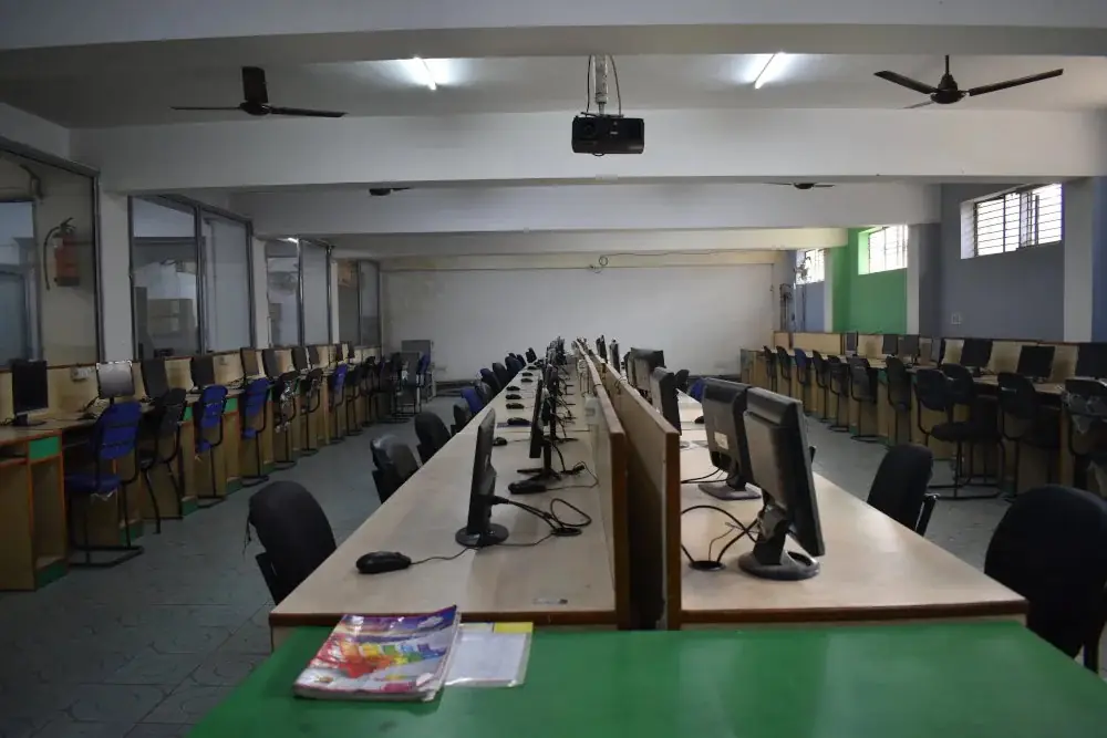 Computer centre with rows of workstations