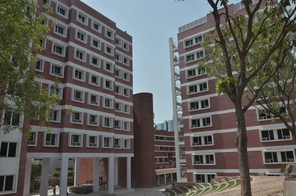 Twin brick towers with courtyard trees