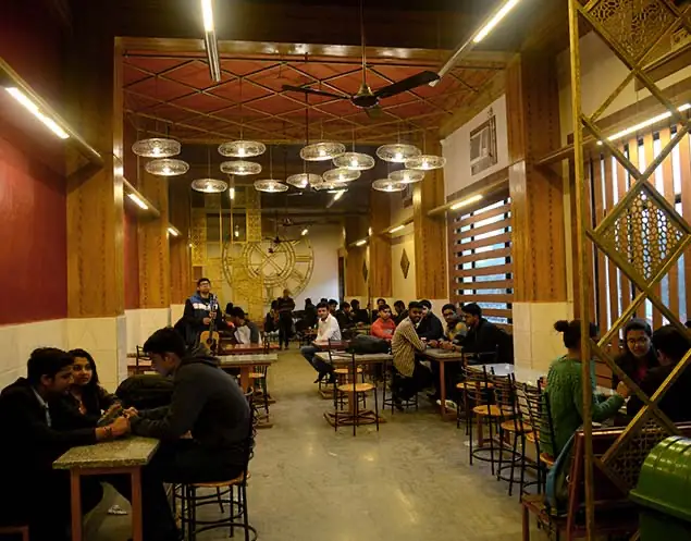 Cafeteria interior with wooden seating