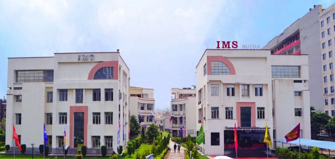Twin academic blocks with flags and central walkway