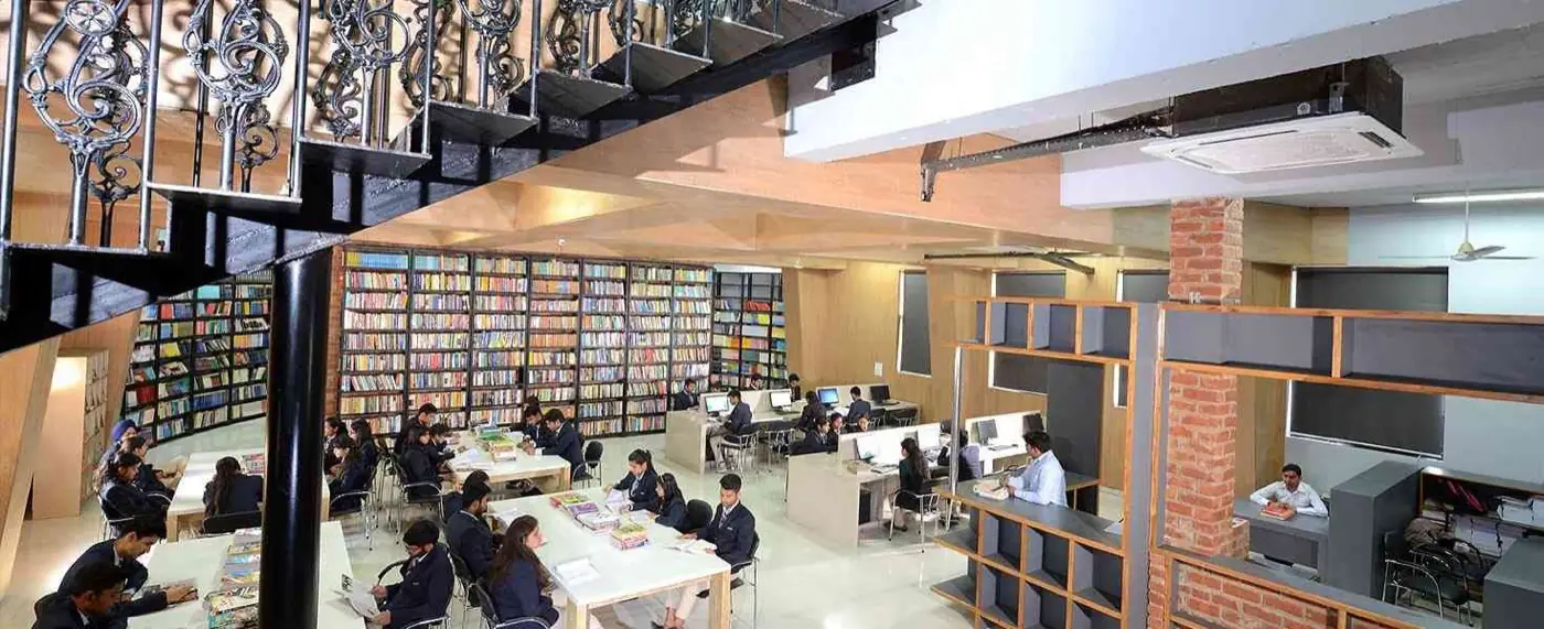 Library with reading tables and book stacks