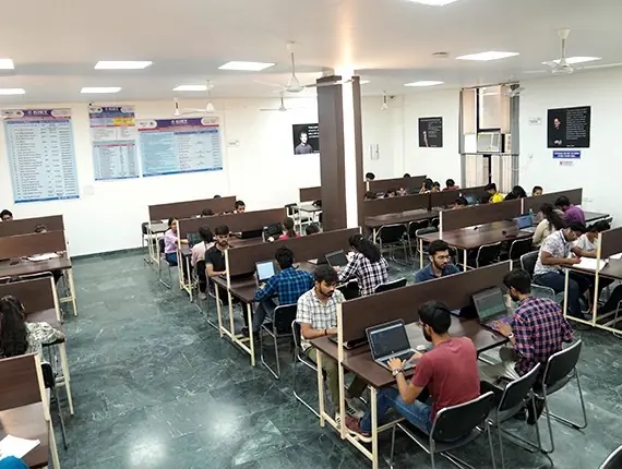 Library reading room with students at desks