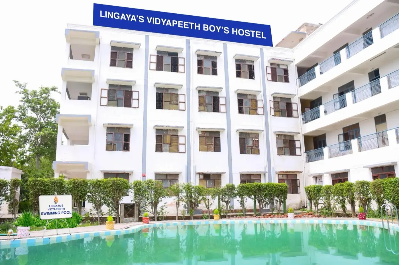 Boys' hostel block with swimming pool in front