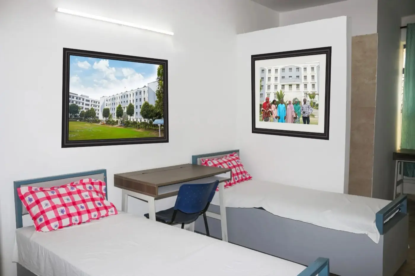 Furnished hostel room with beds and study desk
