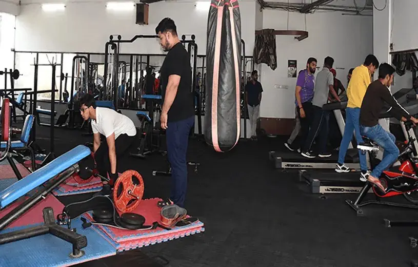 Campus gym with students using equipment