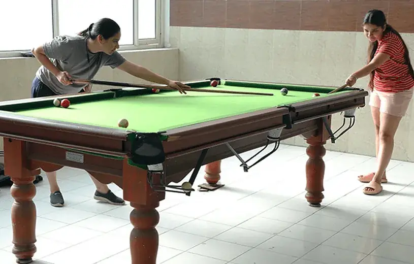 Hostel recreation room with a pool table