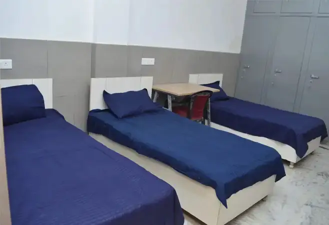 Hostel room with three beds