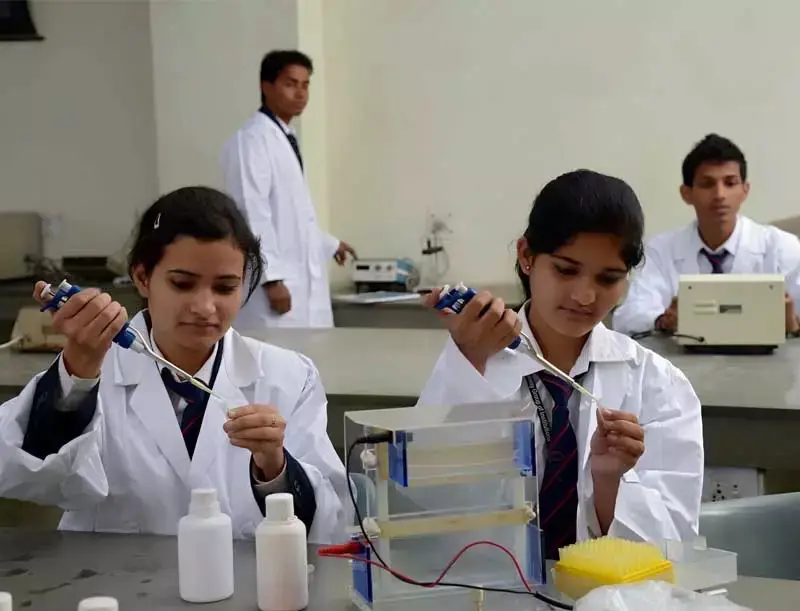 Biotechnology lab with students doing experiments