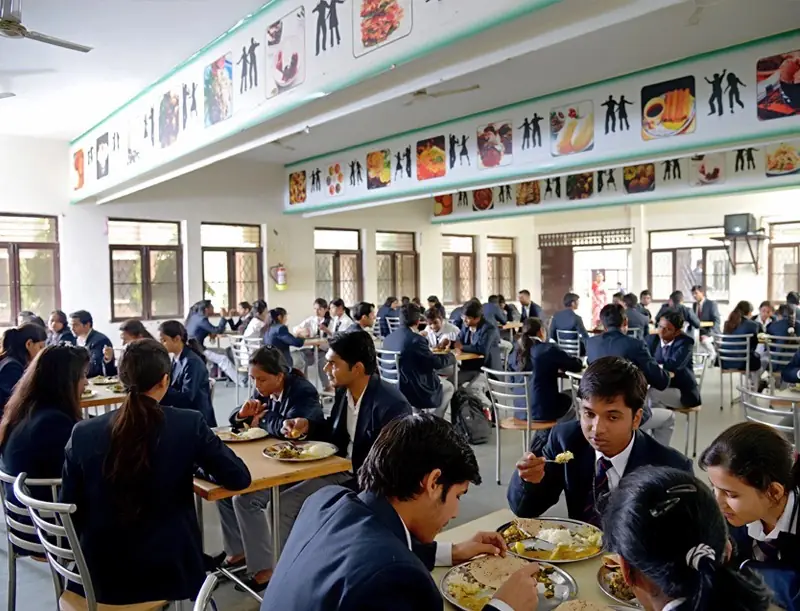 Cafeteria dining hall with students