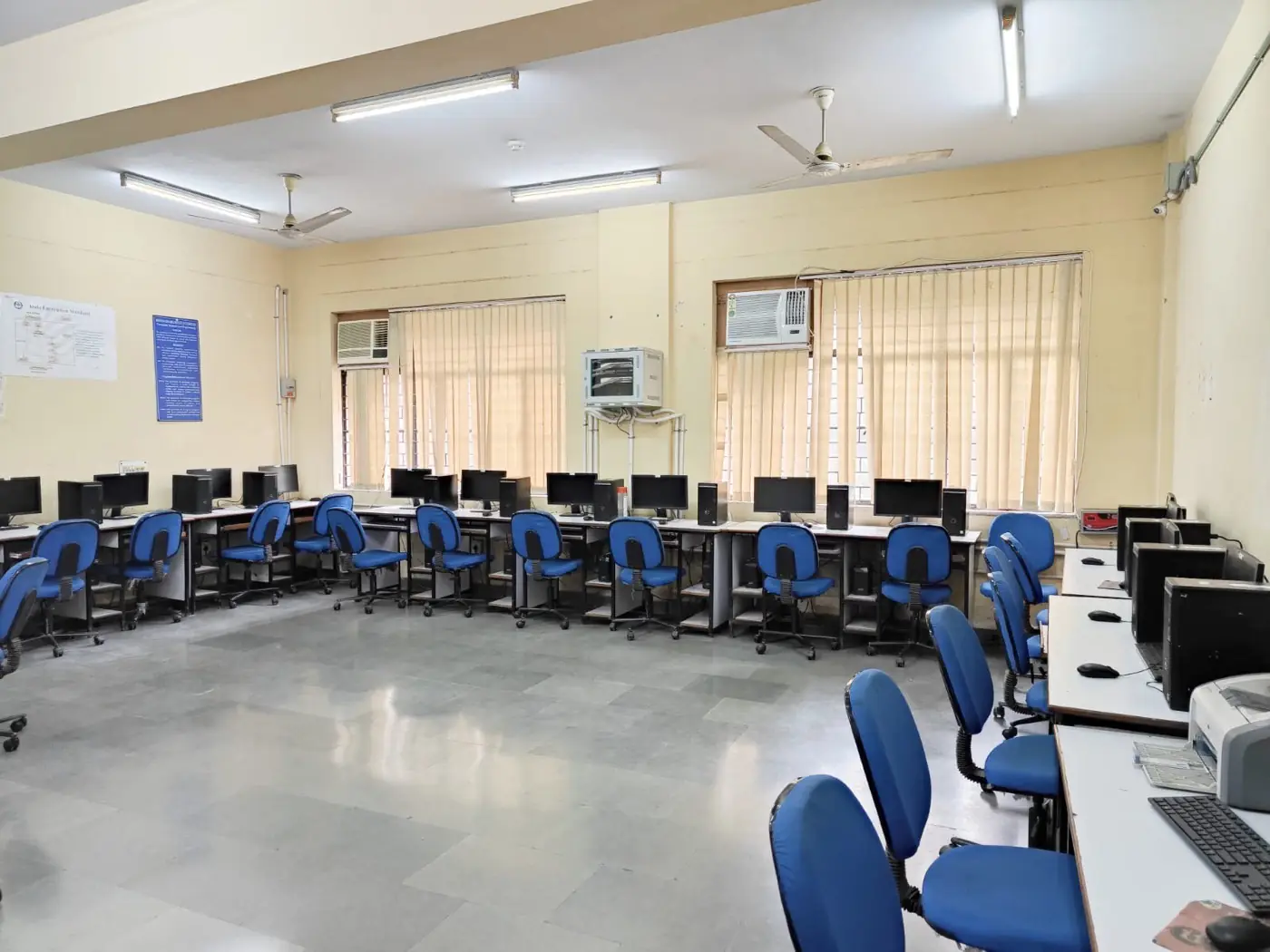 Computer lab with rows of workstations