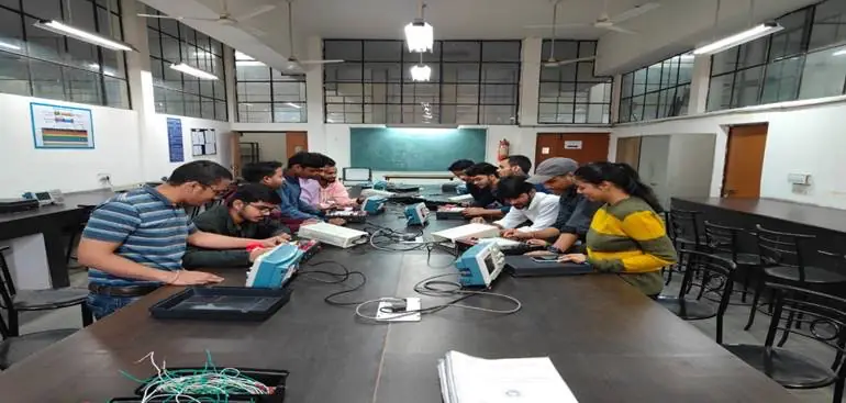 Electronics lab with students at workbenches