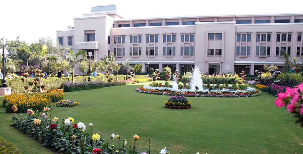 Landscaped lawn and fountain in front of the main academic block